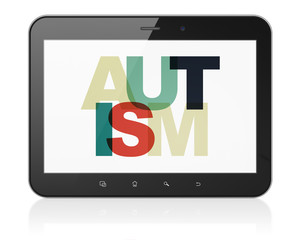 Medicine concept: Tablet Computer with Autism on  display