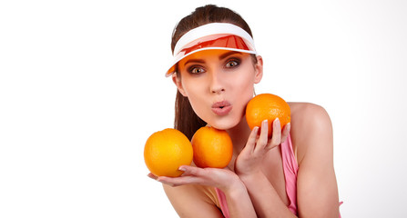 Fototapeta na wymiar Beautiful close-up young woman with oranges. Healthy food concep