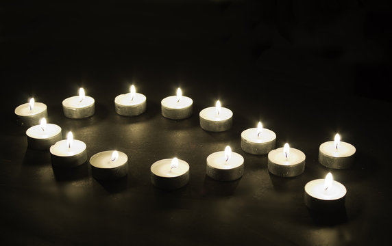 Tea light candles arranged in Christian motif
