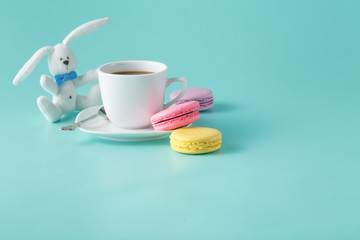 Colored french macaroon and coffee cup