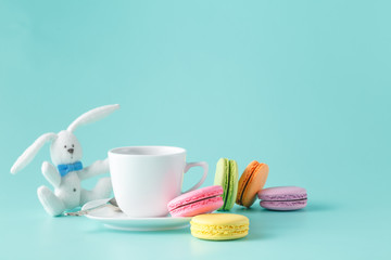 Colored french macaroon and coffee cup