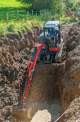 Bagger auf Baustelle am ausheben einer Grube