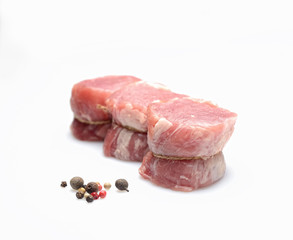 raw fillet medallions on a white background