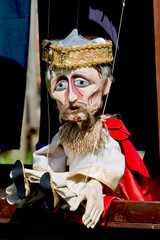 Old wooden doll. Old king - traditional wooden puppet 