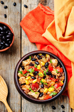 Black beans, corn and tomato red and white rice with chicken