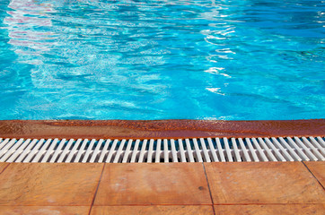 Obraz premium Blue pool water with sun reflections