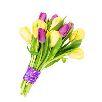 Bouquet of yellow and pink tulips decorated with ribbon, isolated over white background