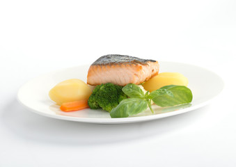 salmon fillet with potato on the white plate 