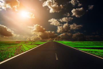 speed highway through the field. asphalt-paved road