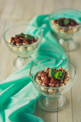 Tiramisu dessert in a glass with mint