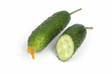 two green cucumber on white background