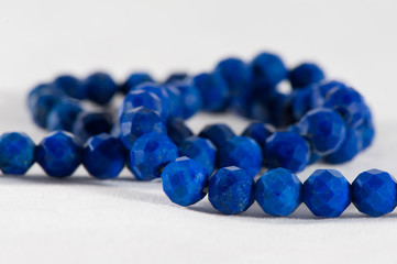 Beads from blue lazurite stone isolated