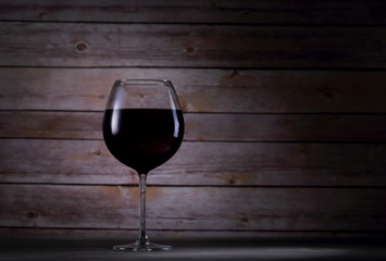 One glass with red wine