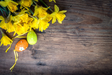 Bunch of daffodils with easter eggs for Easter