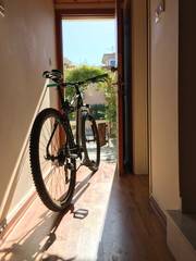 Bicycle indoor home at open door entrance