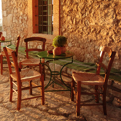 Fototapeta na wymiar empty table at an street village restaurant, Crete, Greece