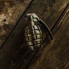 hand grenade on wood