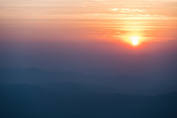 sunset over mountain in evening