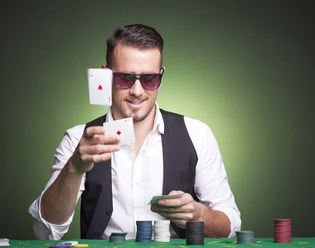 Poker player throwing cards at the table