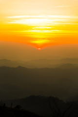 sunset over mountain in evening