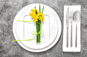 Festive able place setting with spring flowers