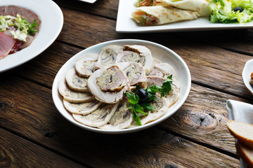 Restaurant food. Sliced white meat roulade