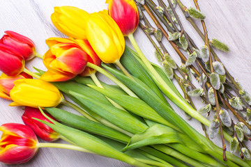Color tulips on wooden background with space for message. Top view. For Mother's Day, Woman's day or Wedding day
