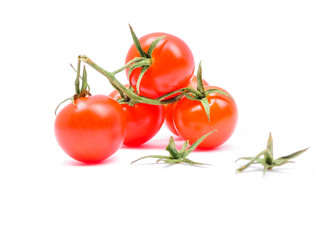 Cherry tomatoes on a branch isolated on white background