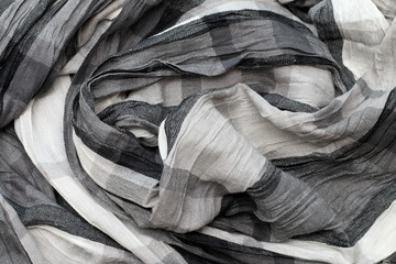 Texture of creased cloth in shades of grey