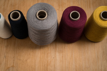 Aligned Spools of Thread Shot at High Angle