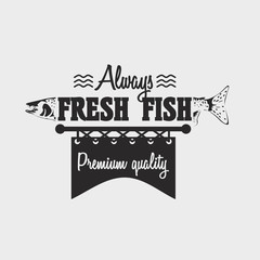 Fototapeta premium Logo or badge template with salmon fish and text Always fresh fish