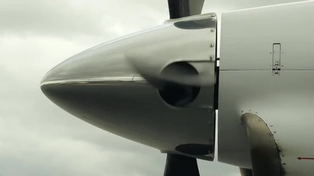 Airplane Propeller Starting to Spin, Slow Zoom Out