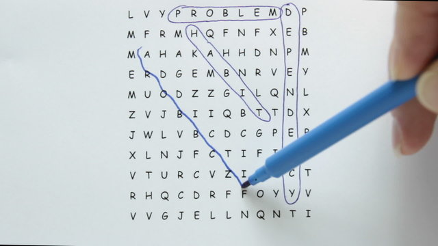 Word search puzzle with addiction being circled in blue pen with supporting words in text.