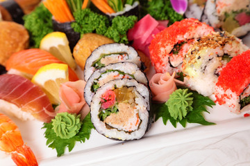 Assorted sushi with ginger and wasabi on plate