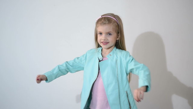 Photographer taking pictures of the child in the studio.