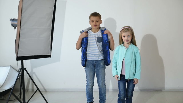 Photographer taking pictures of the child in the studio.