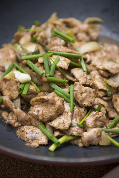 fried pork with black pepper and green onions