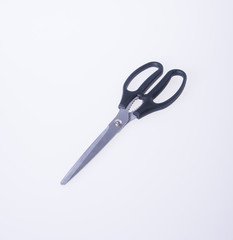 Fototapeta premium scissors or black steel scissors on a background.