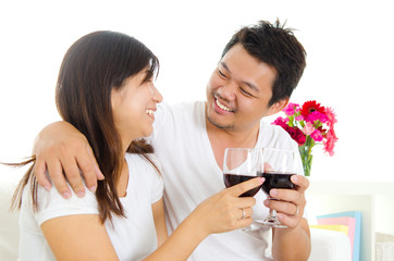 Asian couple having wine