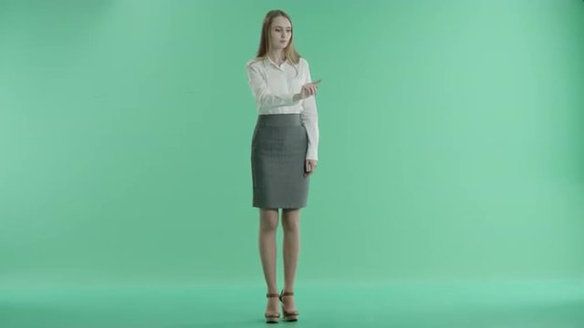 business woman and touchscreen technology on a green screen
