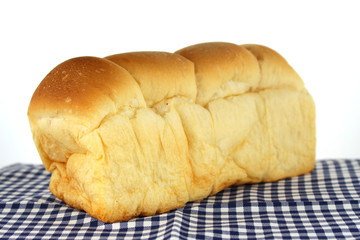  loaf of bread on tablecloth