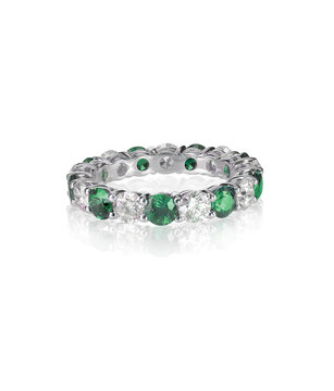 green emerald and diamond wedding band ring isolated on white