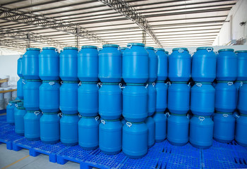 Blue Plastic barrels contain