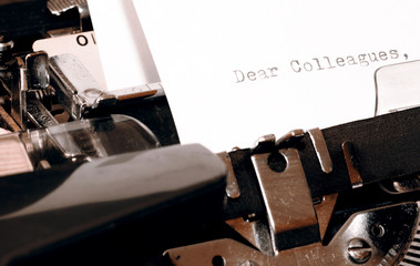 Text Dear Colleagues typed on old typewriter