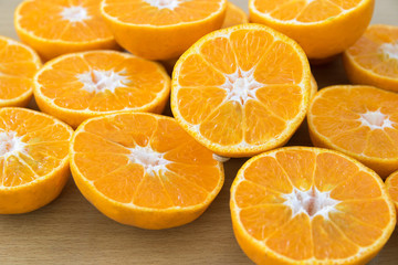 fresh oranges cut in half on cutting board. Top view. Horizontal