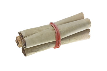 Tobacco covered with banana leaf isolated on white