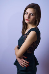 Naklejka premium portrait of a beautiful girl on a violet background