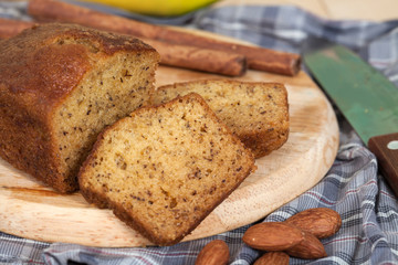 Homemade banana bread sliced on a table . rustic style