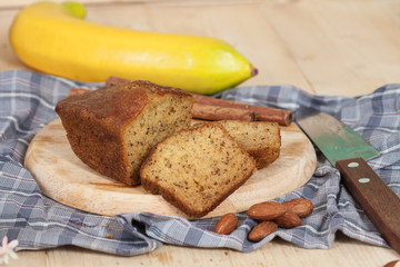 Homemade banana bread sliced on a table . rustic style