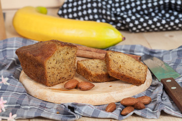 Homemade banana bread sliced on a table . rustic style